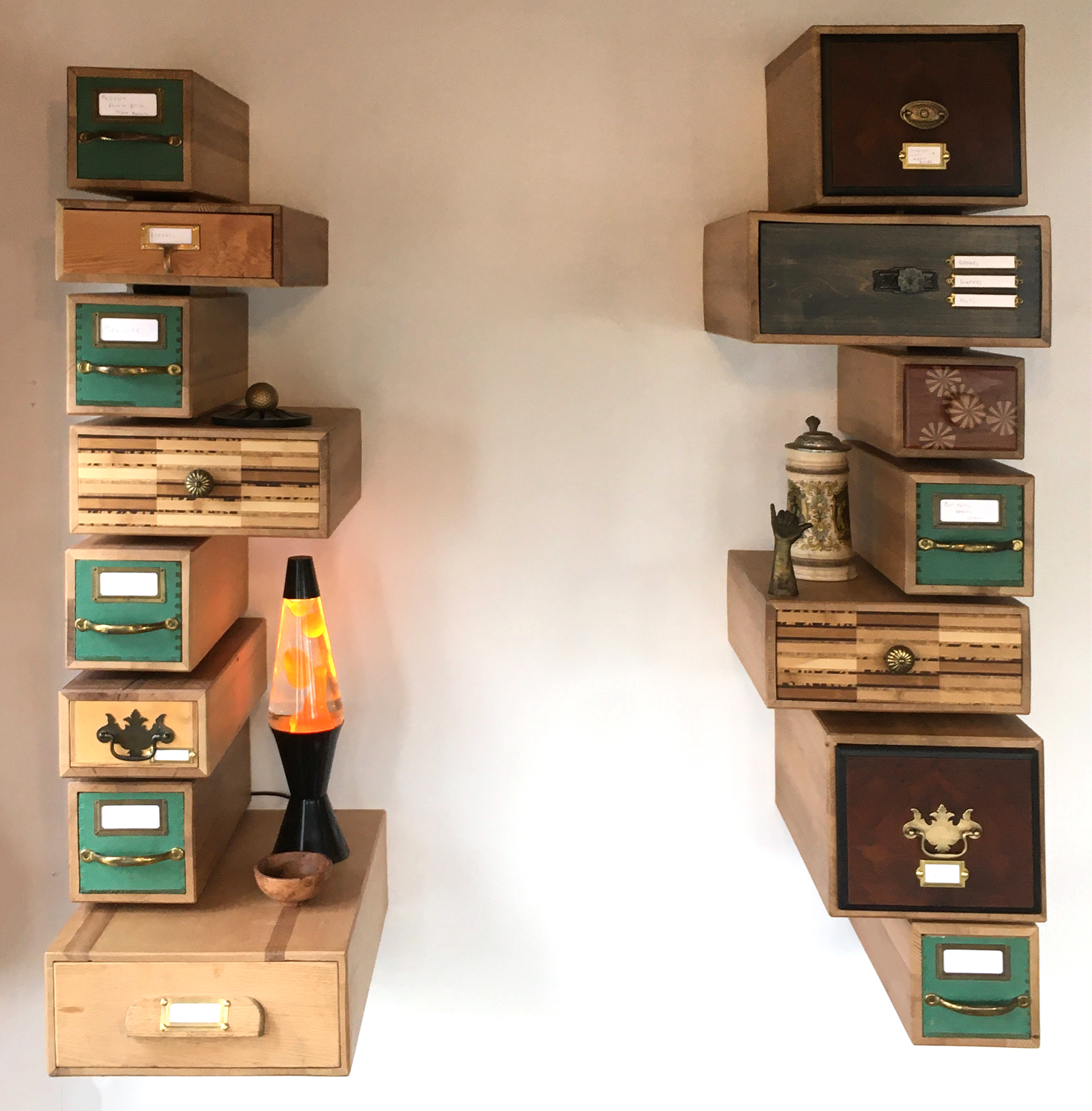 The different sizes of drawers create small shelf spaces for lighting and other objects. 