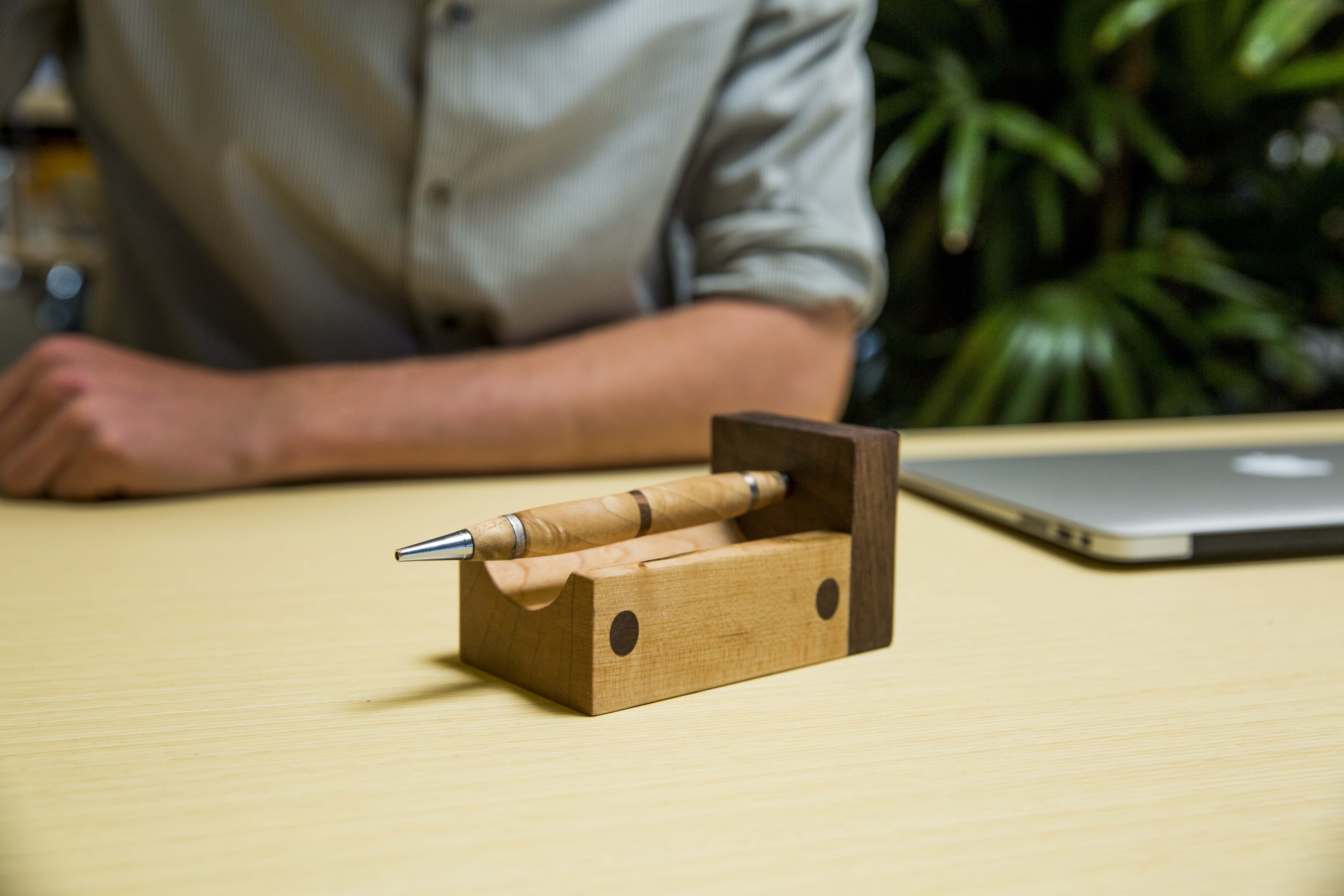 This pen has embedded magnets allowing it to levitate when placed in the stand.