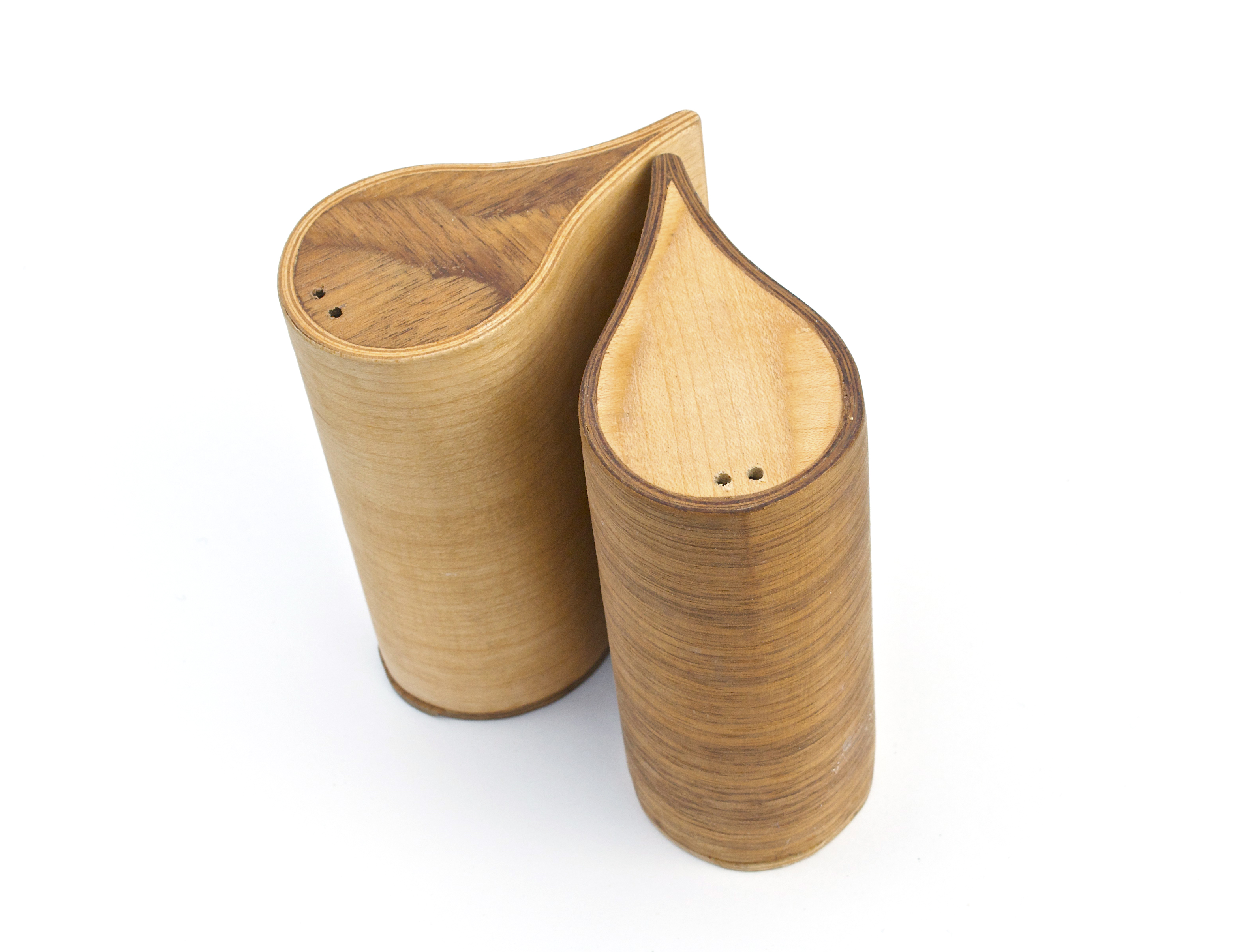 Bent lamination salt and pepper shakers. 