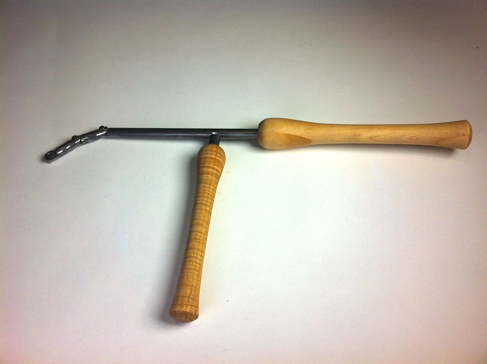 This articulating head turning tool is specifically designed for turning hollow wooden vessels. The head is adjustable to reach a variety of different angles within a vessel.